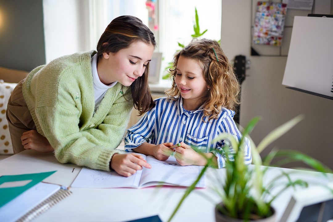 Teenager Girl Helping Sister To Learn Indoors At H 2023 11 27 04 58 45 Utc